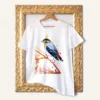 Spotted Pardalote watercolor painting printed on a white cotton T-shirt by Slaveika Aladjova